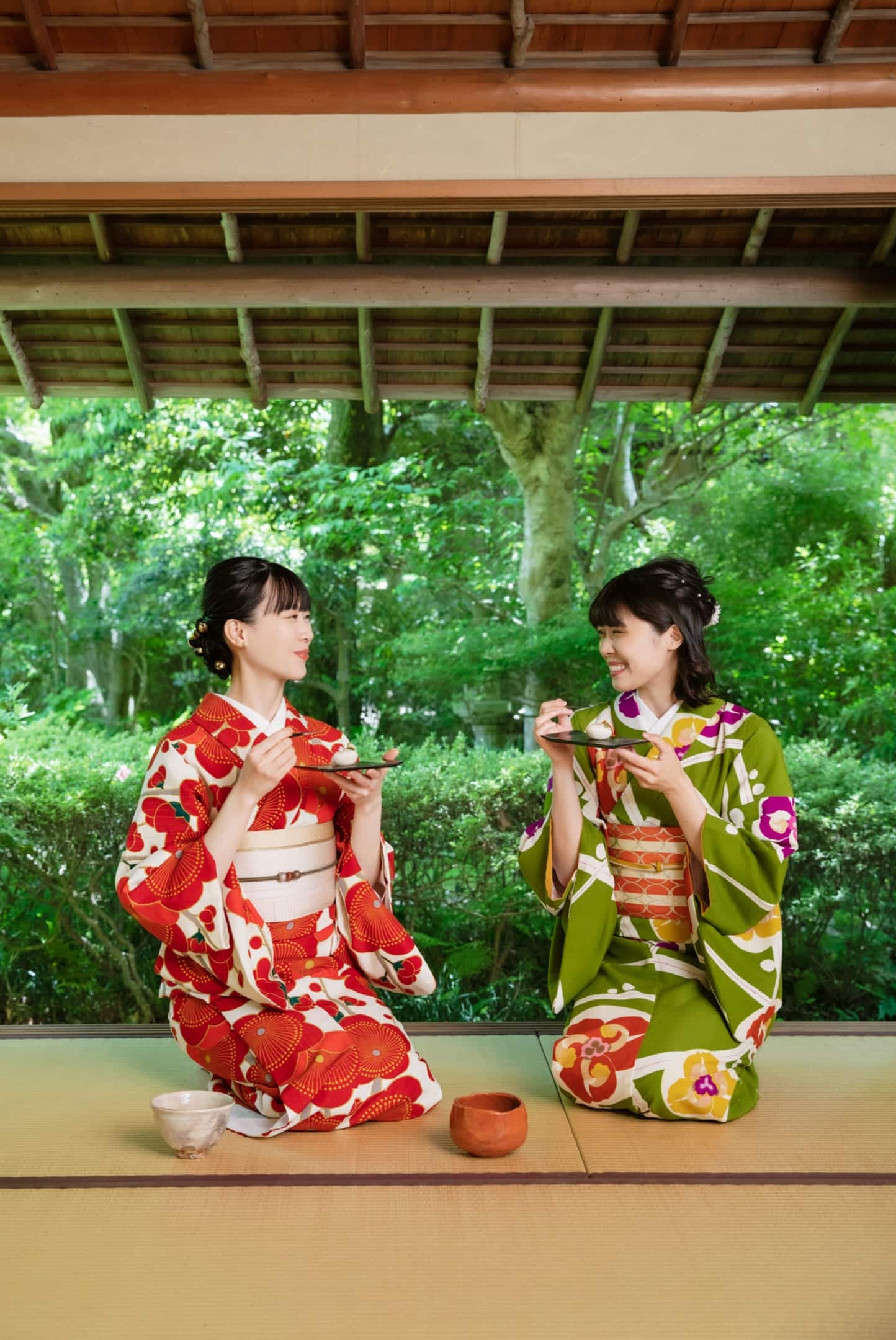 Tourists enjoying wagashi in kimono