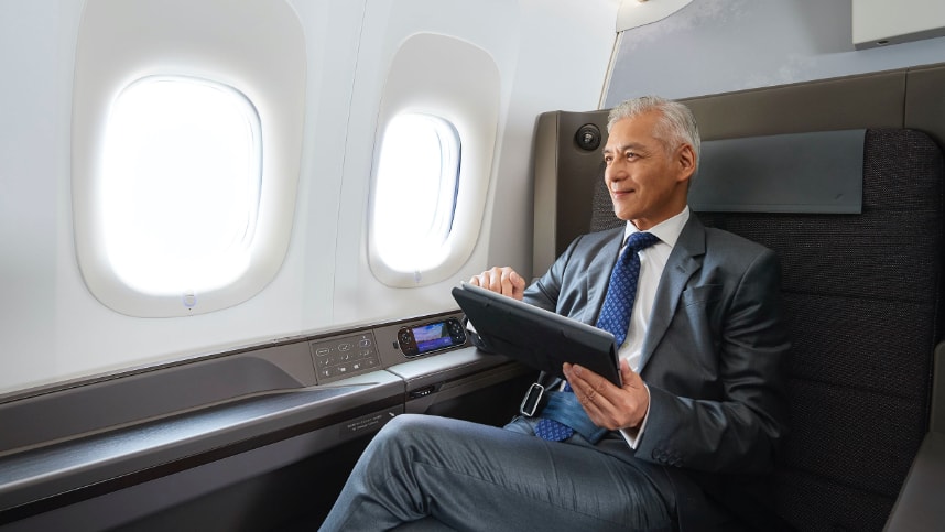 man sitting on first class seats